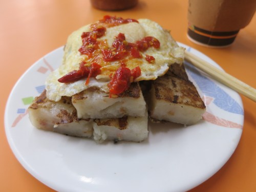 My daily breakfast of lotus cake topped with a fried egg and chili sauce