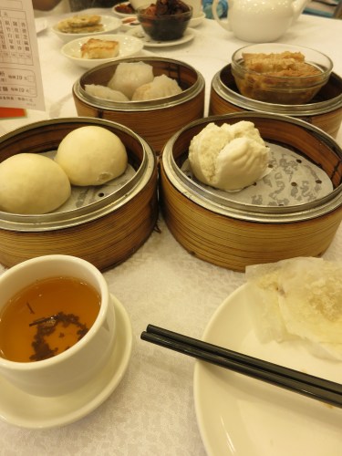 One of the most quintessential experience in Hong Kong is sitting down to a Dim Sum feast. Though the crowded and cavernous restaurants can be intimidating at first, once you've found your seat a one of the communal table, the rest flows smoothly and easily: simply keep an eye out for the passing carts emerging from the kitchens, point at whatever catches your eye as they pass by, and then enjoy. The waiters will simply count your plates once your finished as a way of tallying up the bill.