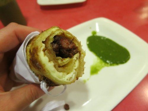Every country has its own late-night drunk food, and India is no exception.  In this case, the nosh of choice is a Khadi (or Kati) Roll, where a variety of meats are served rolled in a greasy paratha with a side of the ever-present green coriander sauce