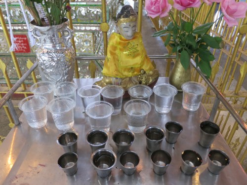A small shrine set up at one corner of the reclining Buddha