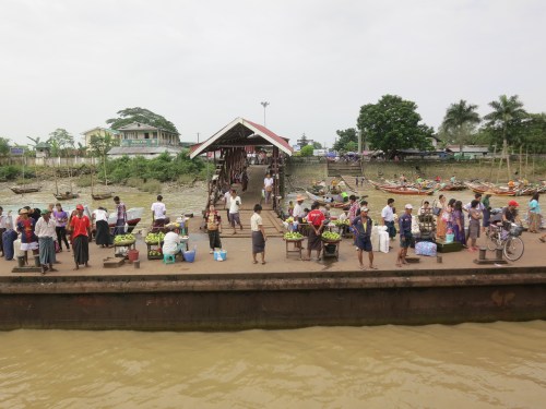 The crowds and vendors awaiting the ferry to arrive at the dock in Dalah
