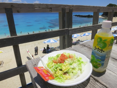 It doesn’t have to be complex to be good – the perfect example being that of the island favorite “Taco Rice.”  Essentially taco ingredients (seasoned beef, lettuce, cheese, and tomatoes) served atop rice as opposed to in corn tortilla shells.  This holdover from the American occupation can be found in almost any restaurant on the islands, but is best eaten while enjoying a beautiful beach view, as seen above