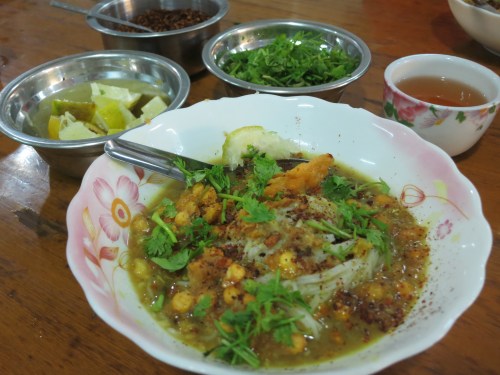 Mohinga, the king of noodles dishes.  This breakfast staple is a dish of thin rice noodles served in a fish broth that is then topped with a variety of toppings, including chili, lentils, crispy bits, lemon, and a few herbs
