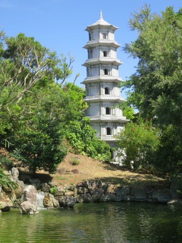 A pagoda towering over the mouth of a bubbling stream