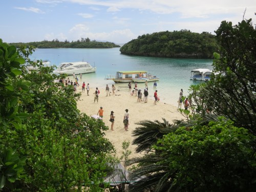 Crowds mingling around the beach area